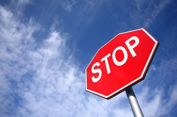  Stop Sign With Blue Sky in the Background